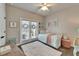 Charming bedroom featuring french doors, wood floors, and decorative accents at 14204 Barrington Stowers Dr, Lithia, FL 33547