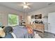 Cozy bedroom with hardwood floors, natural light, and unique decorations at 14204 Barrington Stowers Dr, Lithia, FL 33547