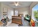 Bright bedroom with wooden floors, a large window and fun decor at 14204 Barrington Stowers Dr, Lithia, FL 33547