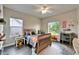 Cozy bedroom with natural light, wooden floors, and playful decor at 14204 Barrington Stowers Dr, Lithia, FL 33547
