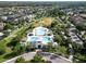 High angle aerial shot showcasing a community pool facility surrounded by parks and residences at 14204 Barrington Stowers Dr, Lithia, FL 33547