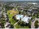 An aerial view of a community pool, park, and green space among a planned residential community at 14204 Barrington Stowers Dr, Lithia, FL 33547
