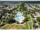 Overhead shot of a resort-style community pool area with palm trees and recreational facilities at 14204 Barrington Stowers Dr, Lithia, FL 33547