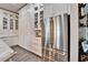 Bright kitchen featuring stainless steel refrigerator with gold accents and white cabinetry for a sleek, modern look at 14204 Barrington Stowers Dr, Lithia, FL 33547