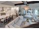 Expansive open-concept living room featuring a gourmet kitchen with stainless steel appliances and ample seating at 14204 Barrington Stowers Dr, Lithia, FL 33547