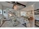 Bright open concept living room leading to kitchen and featuring a staircase at 14204 Barrington Stowers Dr, Lithia, FL 33547