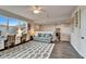 Comfortable living room space with a sofa, two desks and a patterned rug at 14204 Barrington Stowers Dr, Lithia, FL 33547