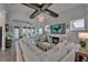 Comfortable living room with fireplace, TV, and plenty of seating open to sun room at 14204 Barrington Stowers Dr, Lithia, FL 33547