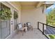 Comfortable covered patio with chairs and outdoor decor at 14204 Barrington Stowers Dr, Lithia, FL 33547