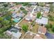 Aerial view of home featuring a fenced yard, mature trees and established landscaping in a residential neighborhood at 14330 Oliver St, Largo, FL 33774