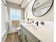 Charming bathroom showcasing updated vanity, decorative backsplash and modern fixtures at 14330 Oliver St, Largo, FL 33774