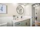 Stylish bathroom highlighting a modern vanity, elegant mirror, and neutral color palette at 14330 Oliver St, Largo, FL 33774