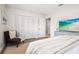 Comfortable bedroom with a plush chair, a large closet, a dresser, and an inviting interior design at 14330 Oliver St, Largo, FL 33774