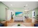 Open living area with a view of the kitchen, dining area, and access to the backyard at 14330 Oliver St, Largo, FL 33774