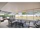 Enclosed patio with comfortable seating, perfect for relaxation and outdoor enjoyment at 14330 Oliver St, Largo, FL 33774