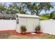 Backyard storage shed with ample storage space and surrounding landscaping at 14330 Oliver St, Largo, FL 33774