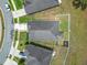 Aerial view of a home featuring a well-kept yard and privacy fence at 15579 Stone House Dr, Brooksville, FL 34604