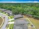 Aerial view of the neighborhood, showcasing the tree lined streets and spacious lots at 15579 Stone House Dr, Brooksville, FL 34604