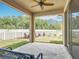 Back porch featuring seating area, fan, and view of the yard at 15579 Stone House Dr, Brooksville, FL 34604