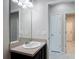 Bathroom featuring a sink, dark cabinets, and tiled floors at 15579 Stone House Dr, Brooksville, FL 34604