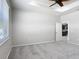 Bright bedroom with tray ceiling, fan, and natural light from a window at 15579 Stone House Dr, Brooksville, FL 34604