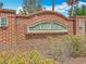 Close-up of the brick community entrance sign for Trillium at 15579 Stone House Dr, Brooksville, FL 34604
