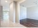Open-concept foyer with tile flooring leading to the living room and dining area at 15579 Stone House Dr, Brooksville, FL 34604
