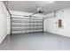 Spacious two-car garage with an automatic door and epoxy flooring at 15579 Stone House Dr, Brooksville, FL 34604