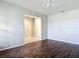Bright living room features hardwood floors, neutral walls, and a ceiling fan at 15579 Stone House Dr, Brooksville, FL 34604