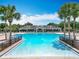 Large community pool with zero-entry feature and plenty of lounge chairs at 15579 Stone House Dr, Brooksville, FL 34604