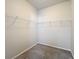 Interior view of walk-in closet featuring wire shelving for organization at 15579 Stone House Dr, Brooksville, FL 34604