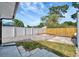 A well-kept backyard, featuring both grassy and gravel areas with a patio, ideal for outdoor living at 15591 Darien Way, Clearwater, FL 33764