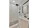 Modern bathroom featuring a black rainfall shower head and frameless glass shower enclosure at 15591 Darien Way, Clearwater, FL 33764