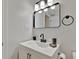Bathroom with a white vanity and black accents at 15591 Darien Way, Clearwater, FL 33764