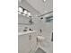 Modern bathroom features a shower/tub combo with marble tile and a vanity with drawers at 15591 Darien Way, Clearwater, FL 33764
