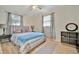 Bright bedroom with a ceiling fan and large windows at 15591 Darien Way, Clearwater, FL 33764