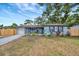 Charming single-story home with a cozy front porch and a well-maintained lawn at 15591 Darien Way, Clearwater, FL 33764
