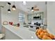 Updated kitchen featuring stainless steel appliances, subway tile, and modern pendant lighting at 15591 Darien Way, Clearwater, FL 33764