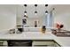Open kitchen layout featuring stainless steel appliances and a breakfast bar at 15591 Darien Way, Clearwater, FL 33764