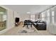 Comfortable living room with hardwood floors, and comfortable black leather seating at 15591 Darien Way, Clearwater, FL 33764