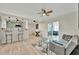 Bright, open-concept living area with bar seating and clear view of the living room at 15591 Darien Way, Clearwater, FL 33764