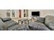 Spacious living room with hardwood floors, large glass sliding door and comfortable seating at 15591 Darien Way, Clearwater, FL 33764
