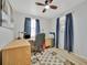 Bright home office with wood desk, rolling chair, and natural light from a window at 15591 Darien Way, Clearwater, FL 33764