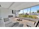 Relaxing screened-in porch with comfortable seating and views of the outdoors at 15591 Darien Way, Clearwater, FL 33764