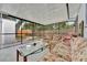 Spacious screened porch featuring comfortable seating and outdoor views at 15591 Darien Way, Clearwater, FL 33764