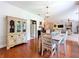 Charming dining area with hardwood floors, flowing into the kitchen and living spaces at 16224 Iola Woods Trl, Dade City, FL 33523
