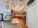 Open concept kitchen with a breakfast bar, stainless steel appliances, and ample counter space at 16224 Iola Woods Trl, Dade City, FL 33523