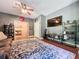 Spacious living room with a large television and movie themed decorations at 16224 Iola Woods Trl, Dade City, FL 33523