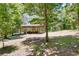 Spacious outbuilding in a private backyard offers ample storage and covered parking at 16224 Iola Woods Trl, Dade City, FL 33523