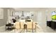 Inviting living space featuring neutral decor, an open-concept kitchen, and stylish furniture arrangement at 16955 Falling Waters Ct, Land O Lakes, FL 34638